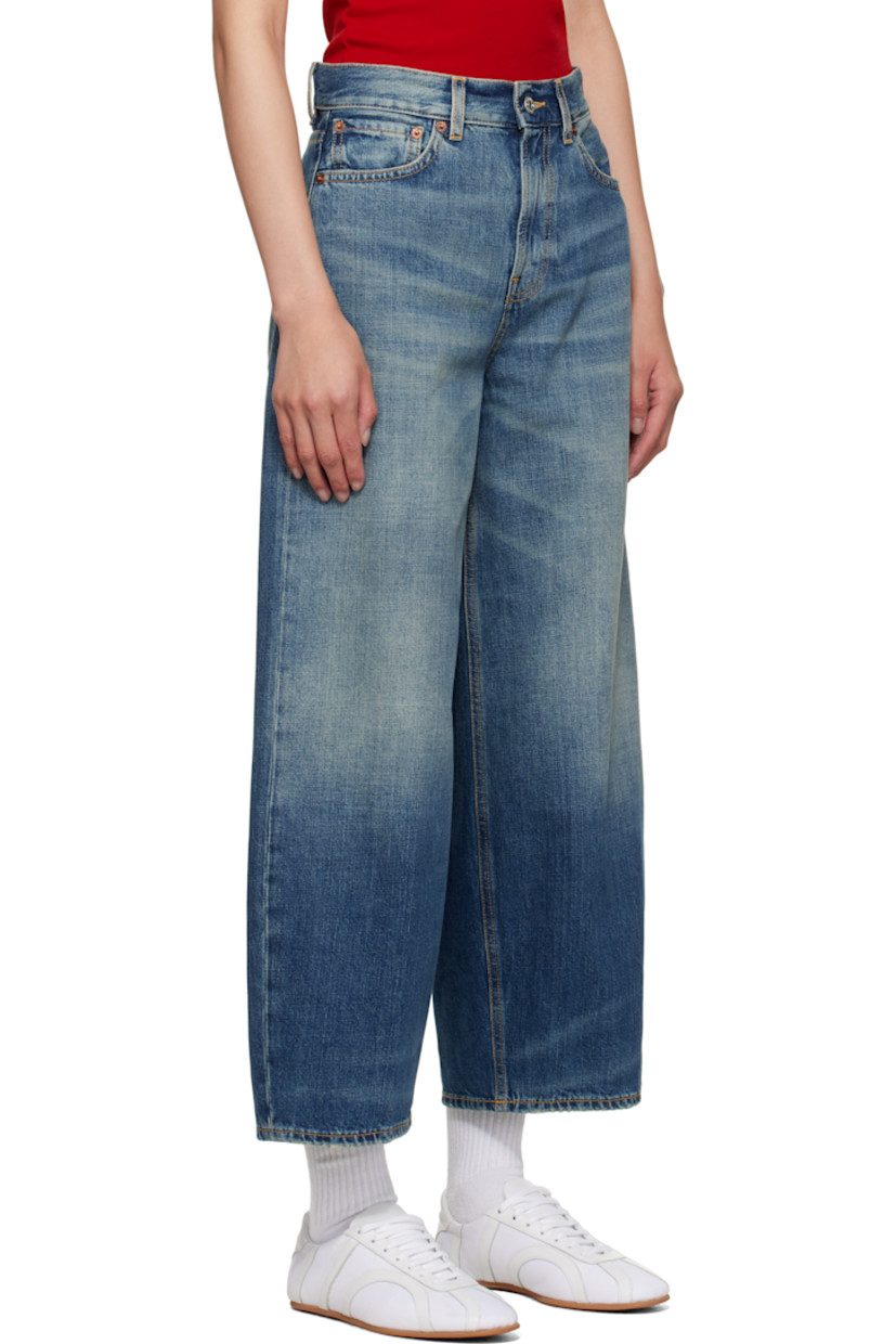 Non-stretch denim jeans.

· Whiskering and fading throughout
· Wide-leg
· High-rise
· Belt loops
· Five-pocket styling
· Zip fly
· Cropped legs
· Subtle distressing at cuffs
· Logo patch at back waistband
· Contrast stitching in tan

Supplier color: Heirloom blue