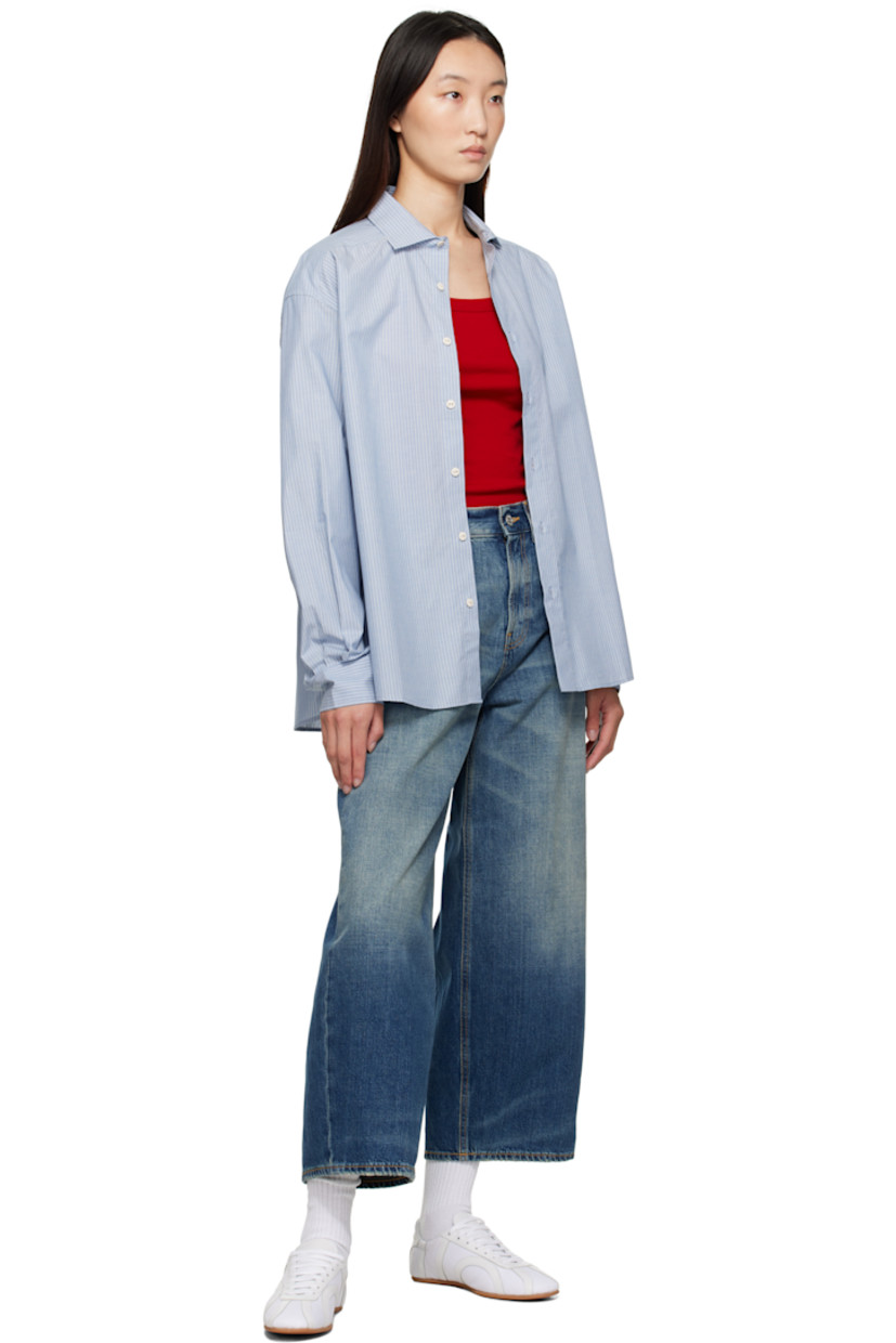 Non-stretch denim jeans.

· Whiskering and fading throughout
· Wide-leg
· High-rise
· Belt loops
· Five-pocket styling
· Zip fly
· Cropped legs
· Subtle distressing at cuffs
· Logo patch at back waistband
· Contrast stitching in tan

Supplier color: Heirloom blue