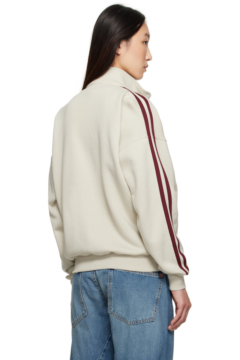 Cotton- and wool-blend fleece sweatshirt.

· Stand collar
· Zip closure
· Zip pockets at front
· Rib-knit hem and cuffs
· Dropped shoulders
· Stripes at sleeves

Supplier color: Putty