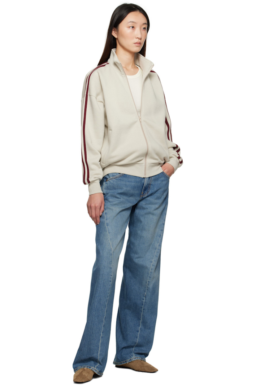 Cotton- and wool-blend fleece sweatshirt.

· Stand collar
· Zip closure
· Zip pockets at front
· Rib-knit hem and cuffs
· Dropped shoulders
· Stripes at sleeves

Supplier color: Putty