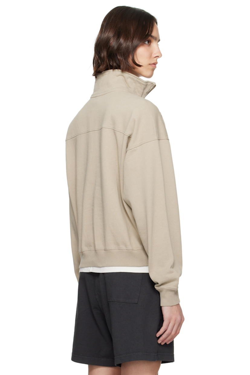Cotton fleece sweatshirt.

· Pre-shrunk
· Stand collar
· Half-zip closure
· Logo printed at chest
· Seam pockets
· Rib-knit hem and cuffs
· Saddle shoulders

Supplier color: Elephant/White