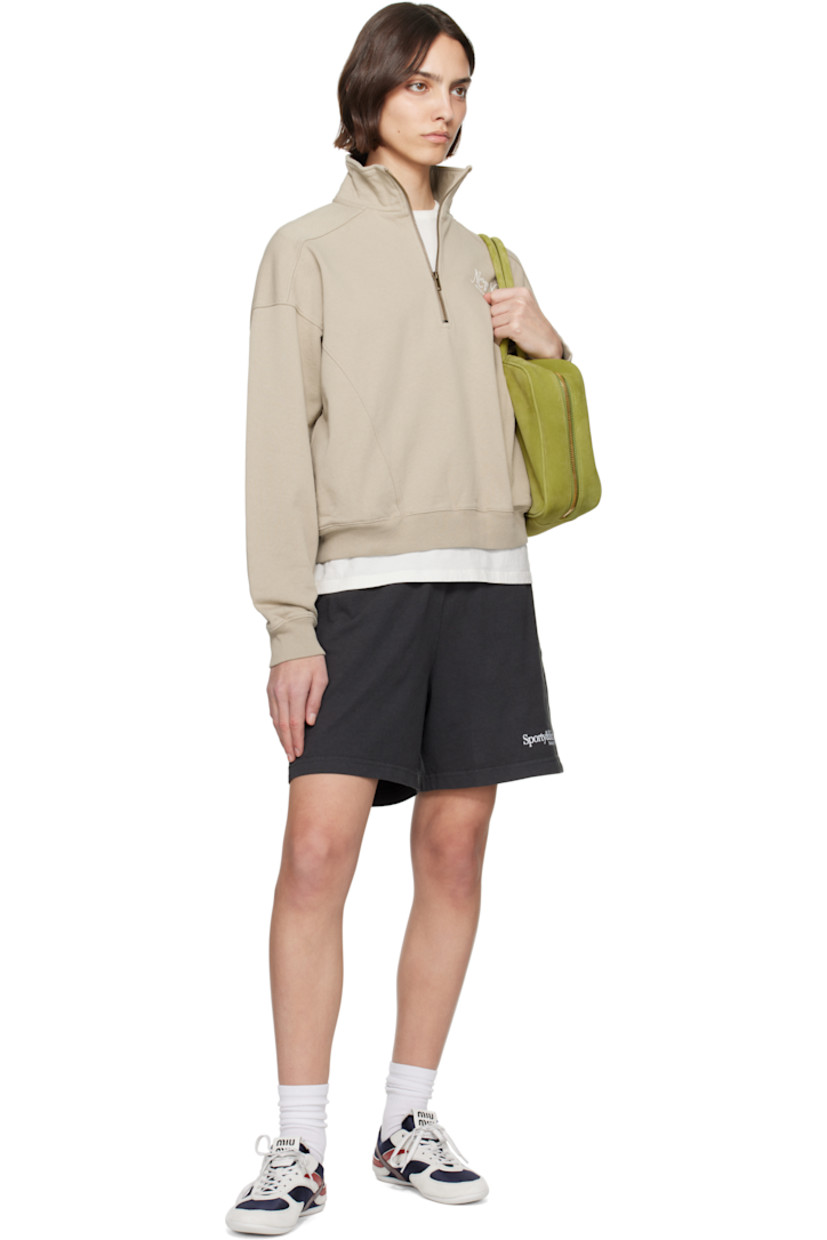 Cotton fleece sweatshirt.

· Pre-shrunk
· Stand collar
· Half-zip closure
· Logo printed at chest
· Seam pockets
· Rib-knit hem and cuffs
· Saddle shoulders

Supplier color: Elephant/White