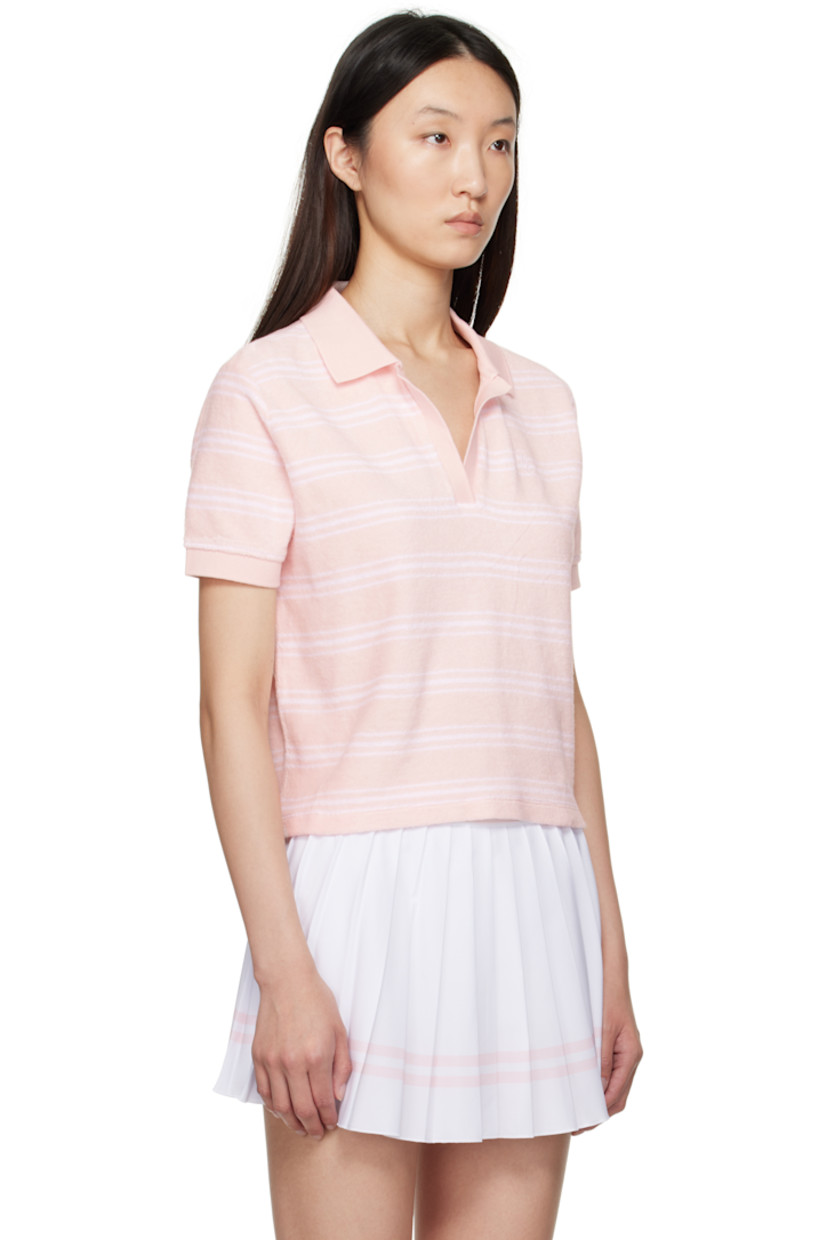 Garment-dyed cotton terrycloth polo. Striped throughout.

· Rib-knit spread collar, placket, and cuffs
· Open placket
· Logo embroidered at chest
· Cropped hem

Supplier color: Pink dolphin striped