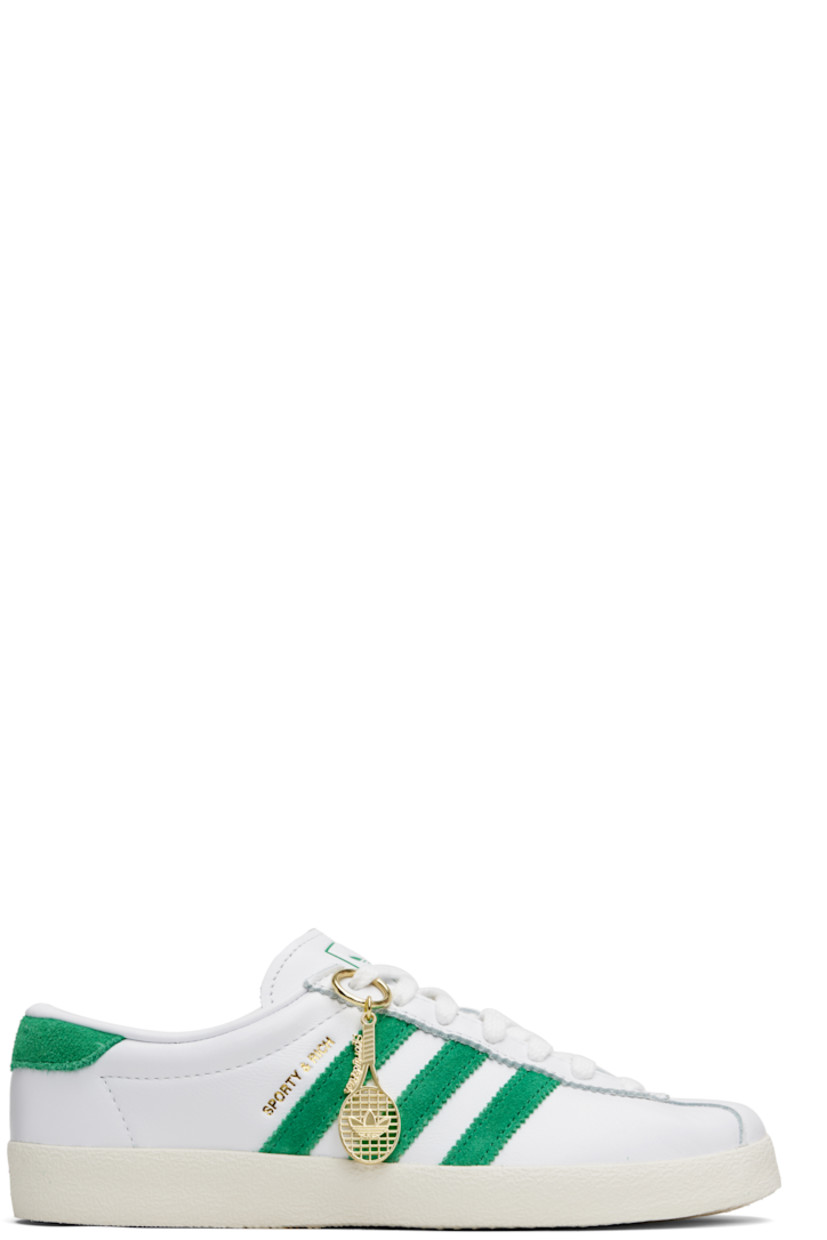Low-top buffed leather and suede sneakers. 

· Serrated edges throughout
· Lace-up closure
· Logo printed at tongue
· Padded collar
· Signature stripes at sides
· Logo stamp at outer side
· Treaded rubber sole

Part of the Sporty & Rich x adidas Originals collaboration.

Supplier color: Cloud white/Off white/Court green