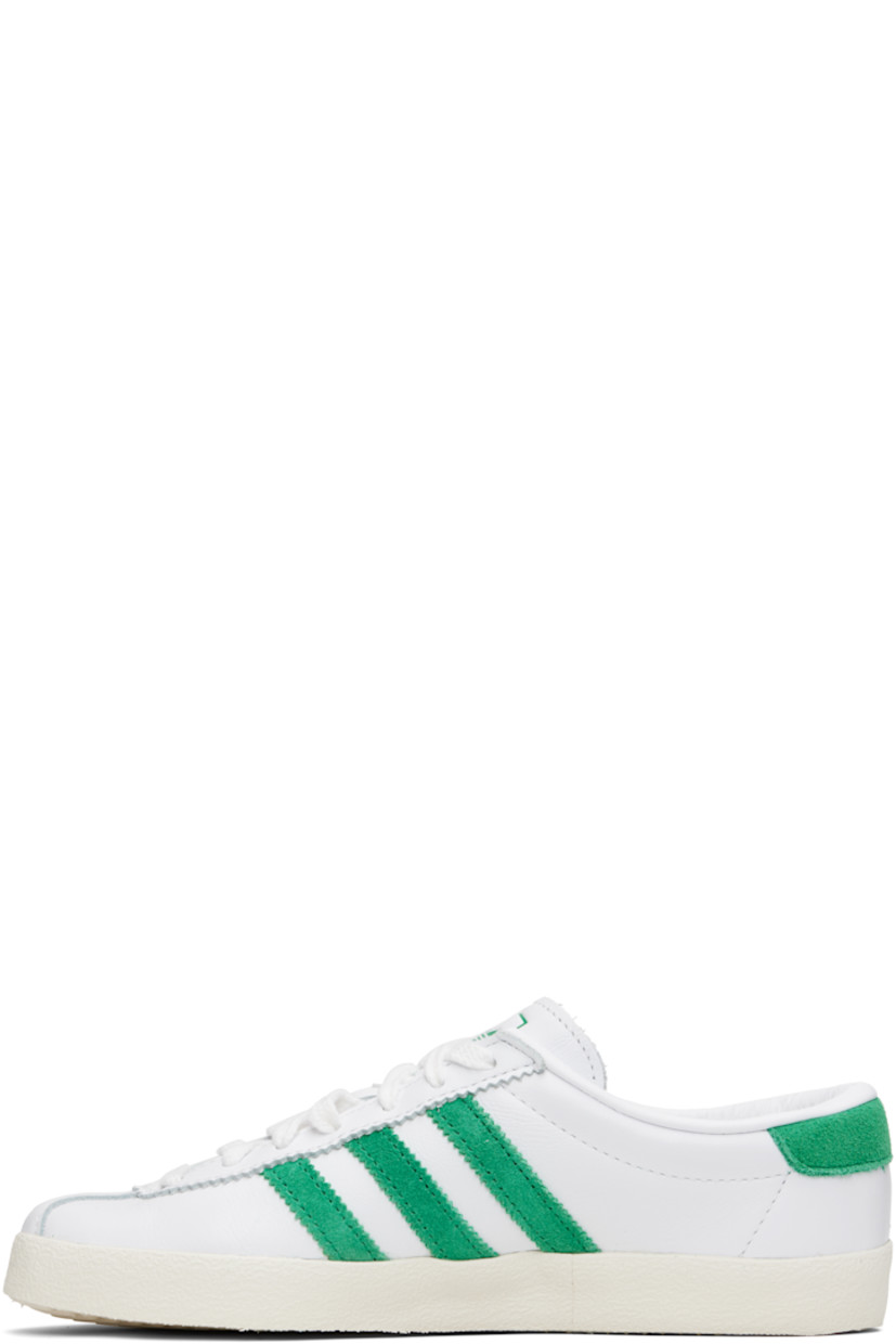 Low-top buffed leather and suede sneakers. 

· Serrated edges throughout
· Lace-up closure
· Logo printed at tongue
· Padded collar
· Signature stripes at sides
· Logo stamp at outer side
· Treaded rubber sole

Part of the Sporty & Rich x adidas Originals collaboration.

Supplier color: Cloud white/Off white/Court green