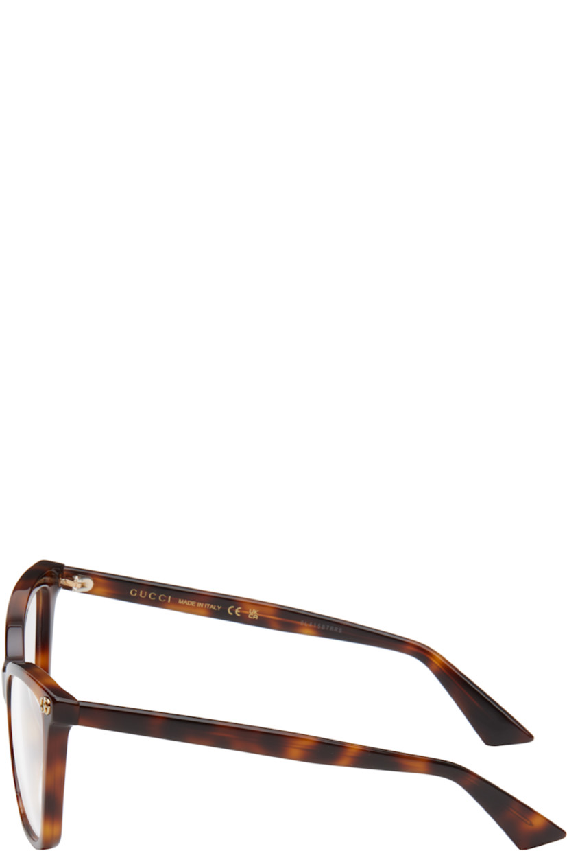 Cat-eye tortoiseshell acetate-frame optical glasses in brown.

· Integrated nose pads
· Logo hardware at face
· Exposed core wire at arms
· Includes pouch
· Size: 55.16 140

Supplier color: Havana