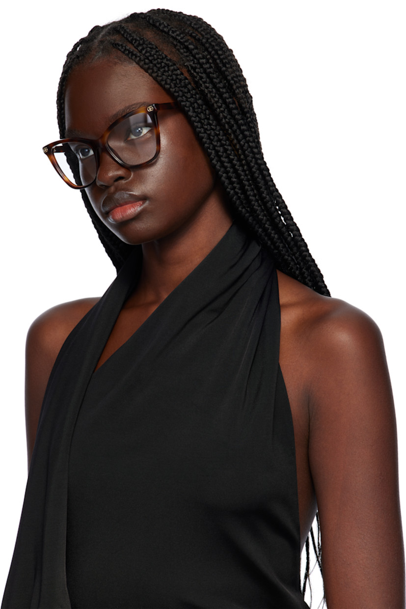 Cat-eye tortoiseshell acetate-frame optical glasses in brown.

· Integrated nose pads
· Logo hardware at face
· Exposed core wire at arms
· Includes pouch
· Size: 55.16 140

Supplier color: Havana