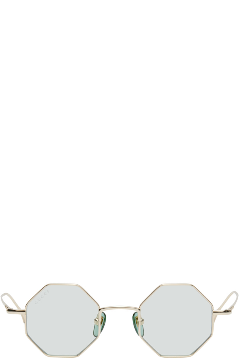 Octangular metal-frame sunglasses in pale gold tone.

· Blue lenses
· 100% UVA/UVB protection, category 1
· Logo etched at lens
· Adjustable rubber nose pads
· Logo engraved at temple and temple tips
· Includes pouch
· Size: 41.22 145

Supplier color: Gold