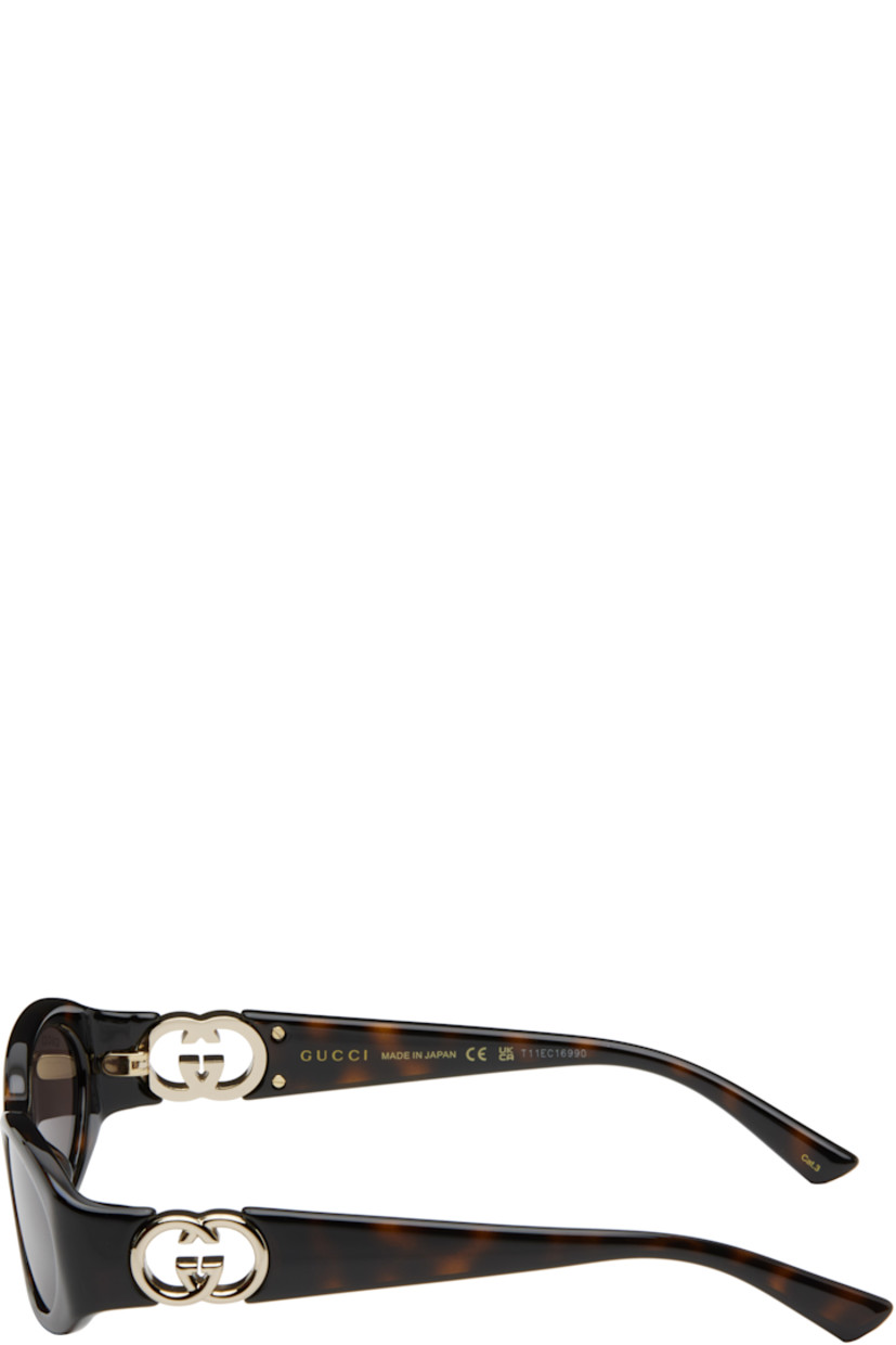Oval tortoiseshell acetate-frame sunglasses in brown.

· Brown lenses, category 3
· 100% UVA/UVB protection
· Logo etched at lens
· Integrated nose pads
· Logo hardware and cutout at temples
· Includes case
· Size: 54.16 135

Supplier color: Tortoiseshell