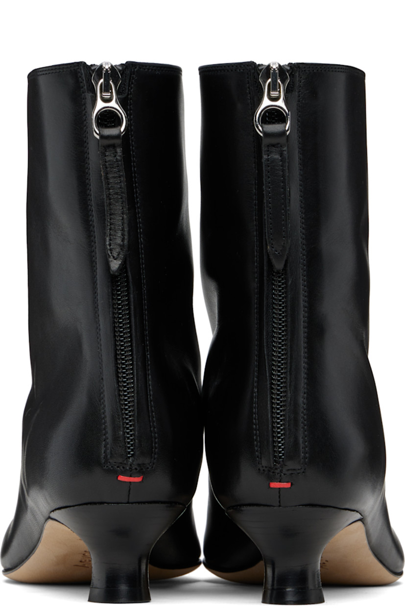 Ankle-high buffed calfskin boots. 

· Pointed toe 
· Lace-up closure at vamp
· Zip closure at back
· Red stitch at heel tab
· Stacked leather kitten heel 
· Nubuck sole with rubber injections 
· Heel: H1.5"

Supplier color: Black