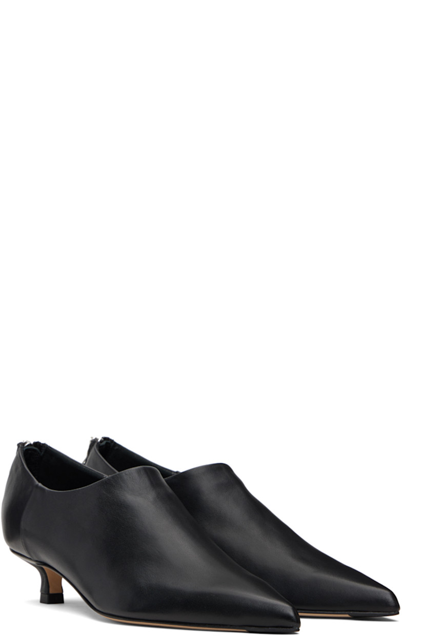 Buffed nappa leather heels.

· Pointed toe 
· Zip closure at back
· Red stitch at heel tab
· Lambskin lining 
· Covered kitten heel
· Nubuck sole with rubber injections
· Heel: H1.5"

Supplier color: Black