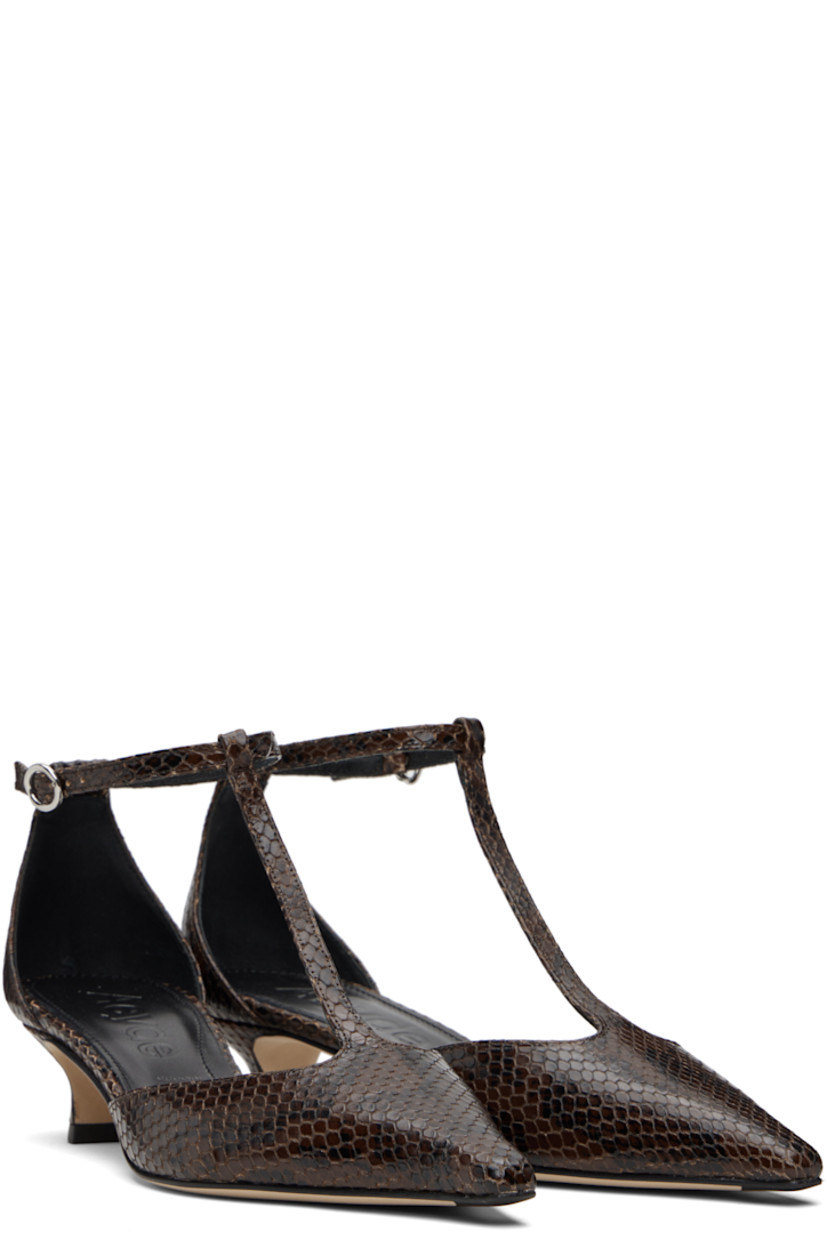 Snakeskin-embossed calfskin heels.

· Pointed toe 
· Strap at vamp
· Pin-buckle ankle strap
· Red stitch at heel counter
· Lambskin lining 
· Covered kitten heel 
· Nubuck sole with rubber injections 
· Heel: H1.5"

Supplier color: Moka