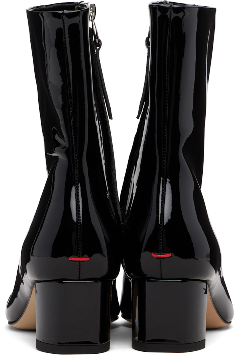 Ankle-high patent calfskin boots.

· Square toe
· Central seam at vamp
· Zip closure at inner side
· Red stitch at heel
· Buffed leather lining
· Covered block heel with rubber injection
· Leather sole
· Heel: H1.75"

Supplier color: Black