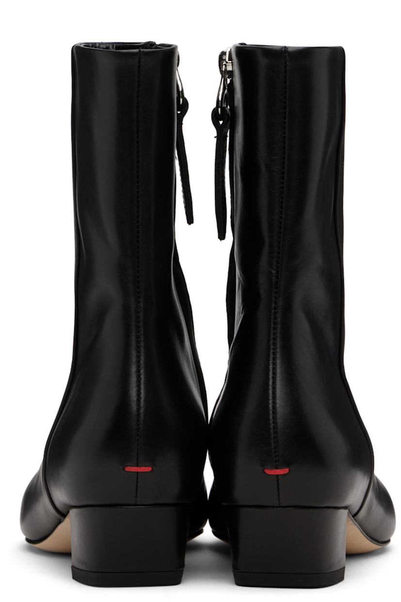 Ankle-high buffed calfskin boots.

· Almond toe
· Zip closure at inner side
· Red stitch at heel
· Buffed leather lining
· Covered block heel with rubber injection
· Leather sole
· Heel: H1.25"

Supplier color: Black