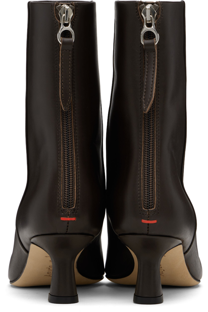 Ankle-high buffed calfskin boots.

· Pointed toe
· Zip closure and red stitch at heel
· Buffed leather lining
· Covered kitten heel
· Leather sole with rubber injections
· Heel: H2"

Supplier color: Moka