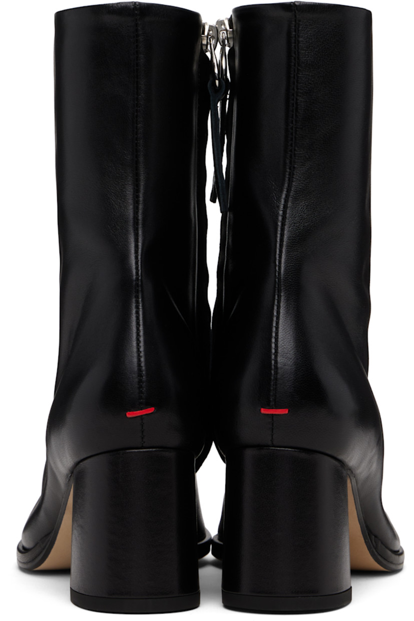 Ankle-high buffed nappa leather boots.

· Central seam at vamp
· Zip closure at inner side
· Red stitch at heel
· Buffed leather lining
· Covered block heel with rubber injection
· Leather sole
· Heel: H2.25"

Supplier color: Black