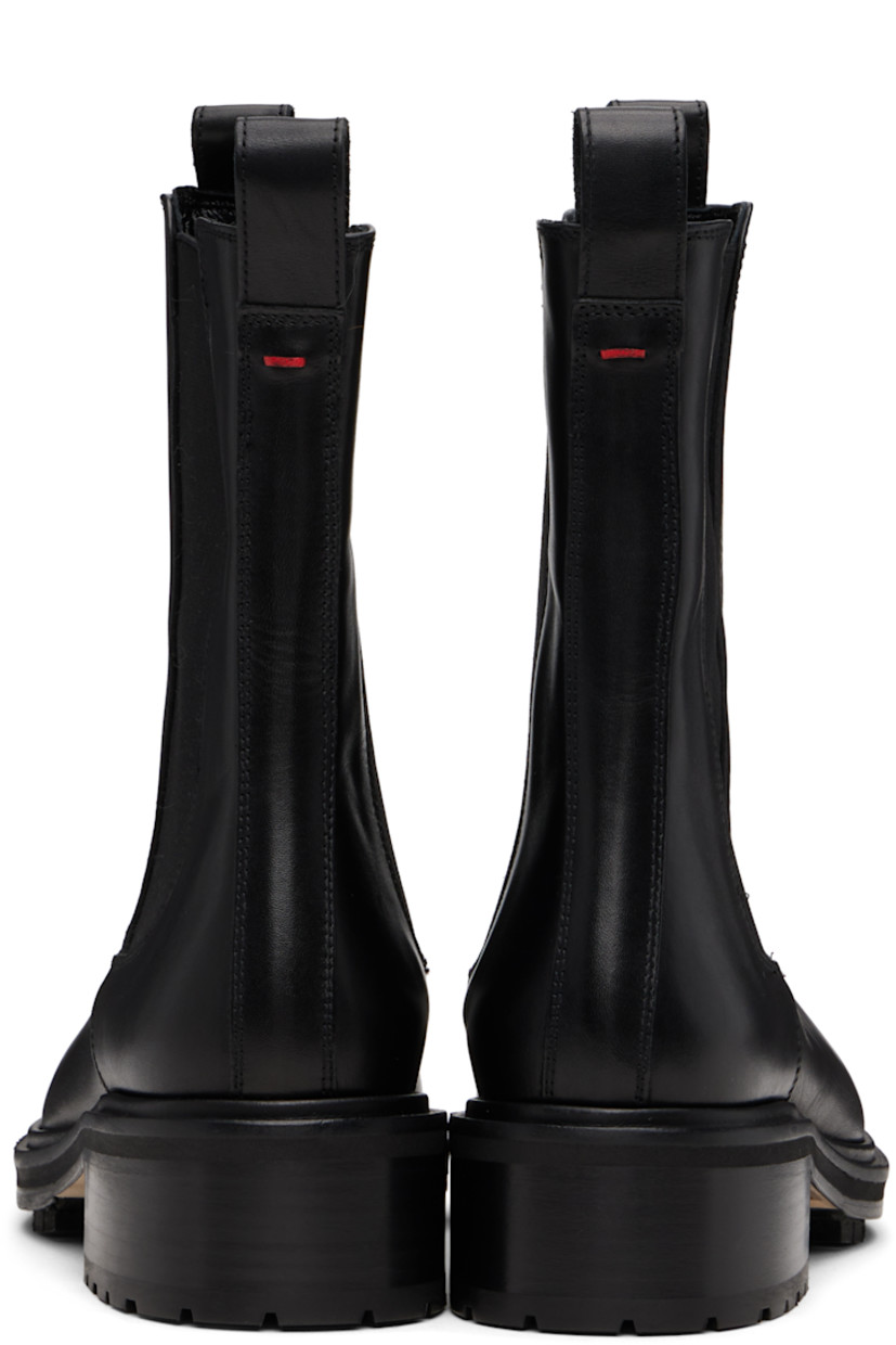 Ankle-high buffed calfskin Chelsea boots.

· Pull-loops at collar
· Elasticized gusset at sides
· Red stitch at heel collar
· Buffed lambskin lining
· Stacked leather and rubber midsole and block heel
· Treaded rubber sole
· Heel: H1"

Supplier color: Black calf