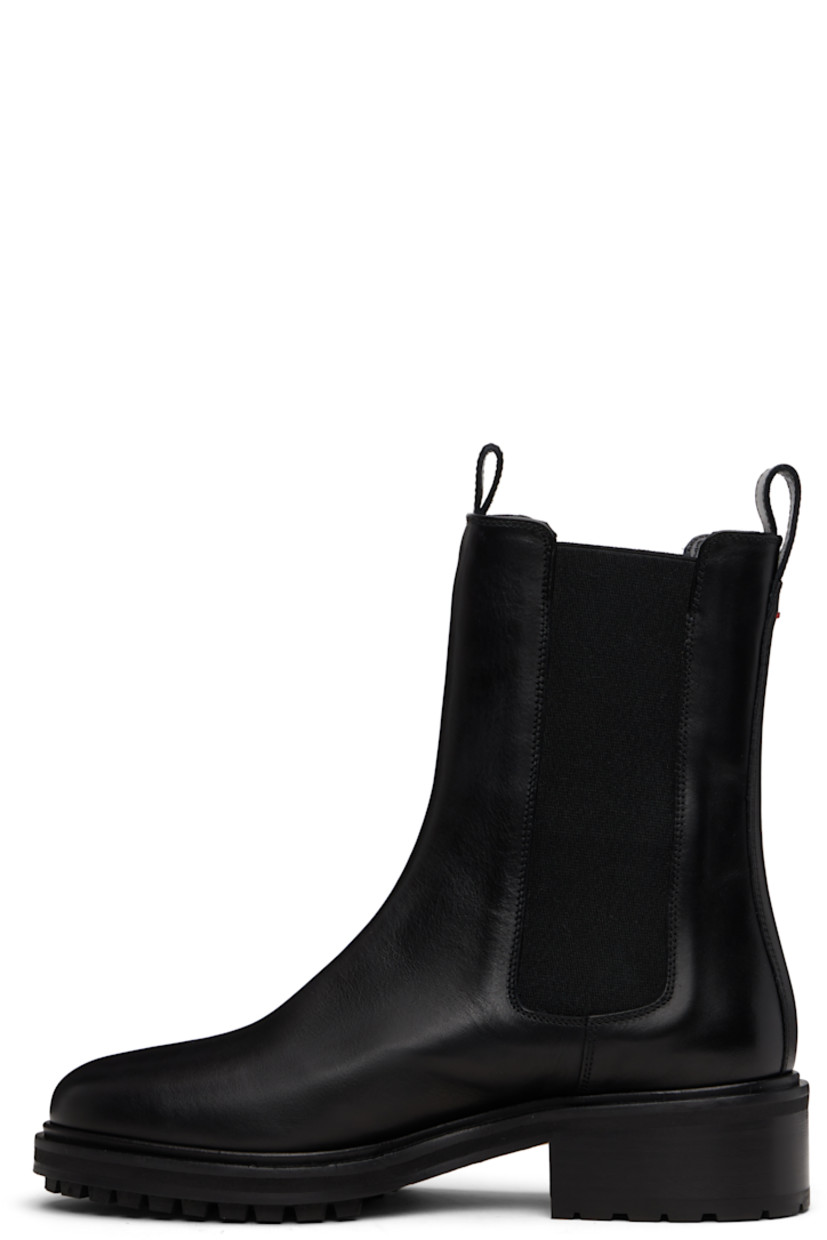 Ankle-high buffed calfskin Chelsea boots.

· Pull-loops at collar
· Elasticized gusset at sides
· Red stitch at heel collar
· Buffed lambskin lining
· Stacked leather and rubber midsole and block heel
· Treaded rubber sole
· Heel: H1"

Supplier color: Black calf