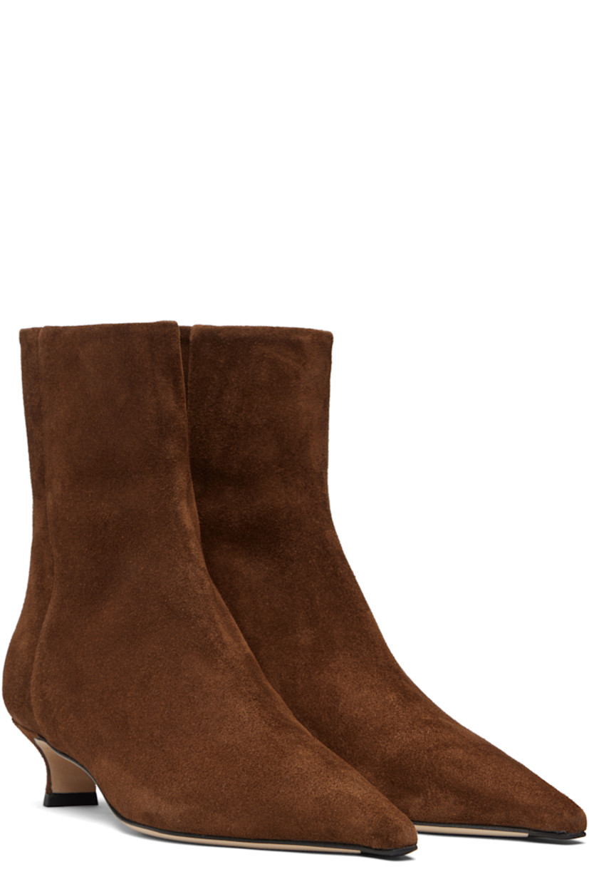 Ankle-high suede boots.

· Pointed toe
· Zip closure at back
· Red stitch at heel counter
· Lambskin lining
· Covered kitten heel 
· Nubuck sole with rubber injections
· Heel: H1.5"

Supplier color: Brown