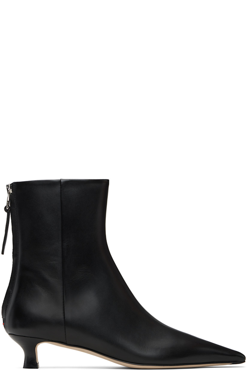 Ankle-high buffed calfskin boots.

· Pointed toe
· Zip closure at back
· Red stitch at heel counter
· Lambskin lining
· Covered kitten heel with rubber injection
· Nubuck sole with rubber injection
· Heel: H1.5"

Supplier color: Black