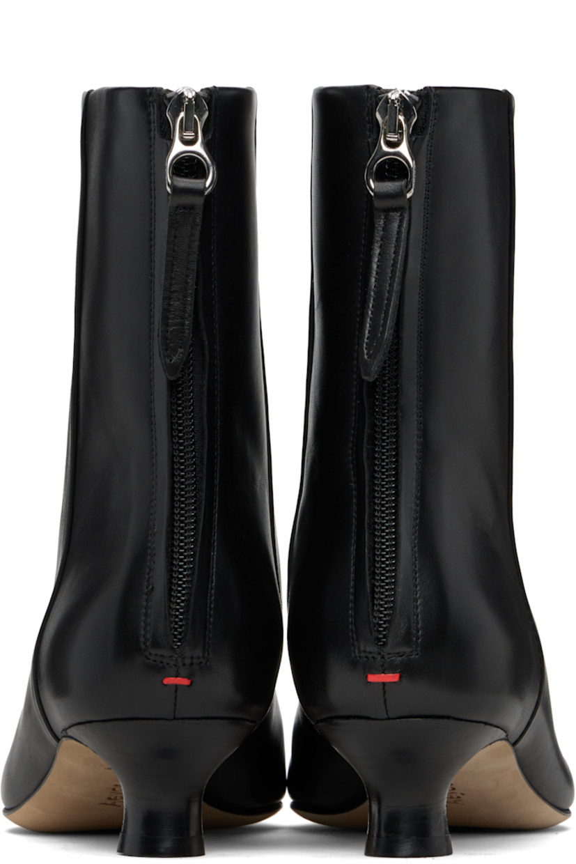 Ankle-high buffed calfskin boots.

· Pointed toe
· Zip closure at back
· Red stitch at heel counter
· Lambskin lining
· Covered kitten heel with rubber injection
· Nubuck sole with rubber injection
· Heel: H1.5"

Supplier color: Black