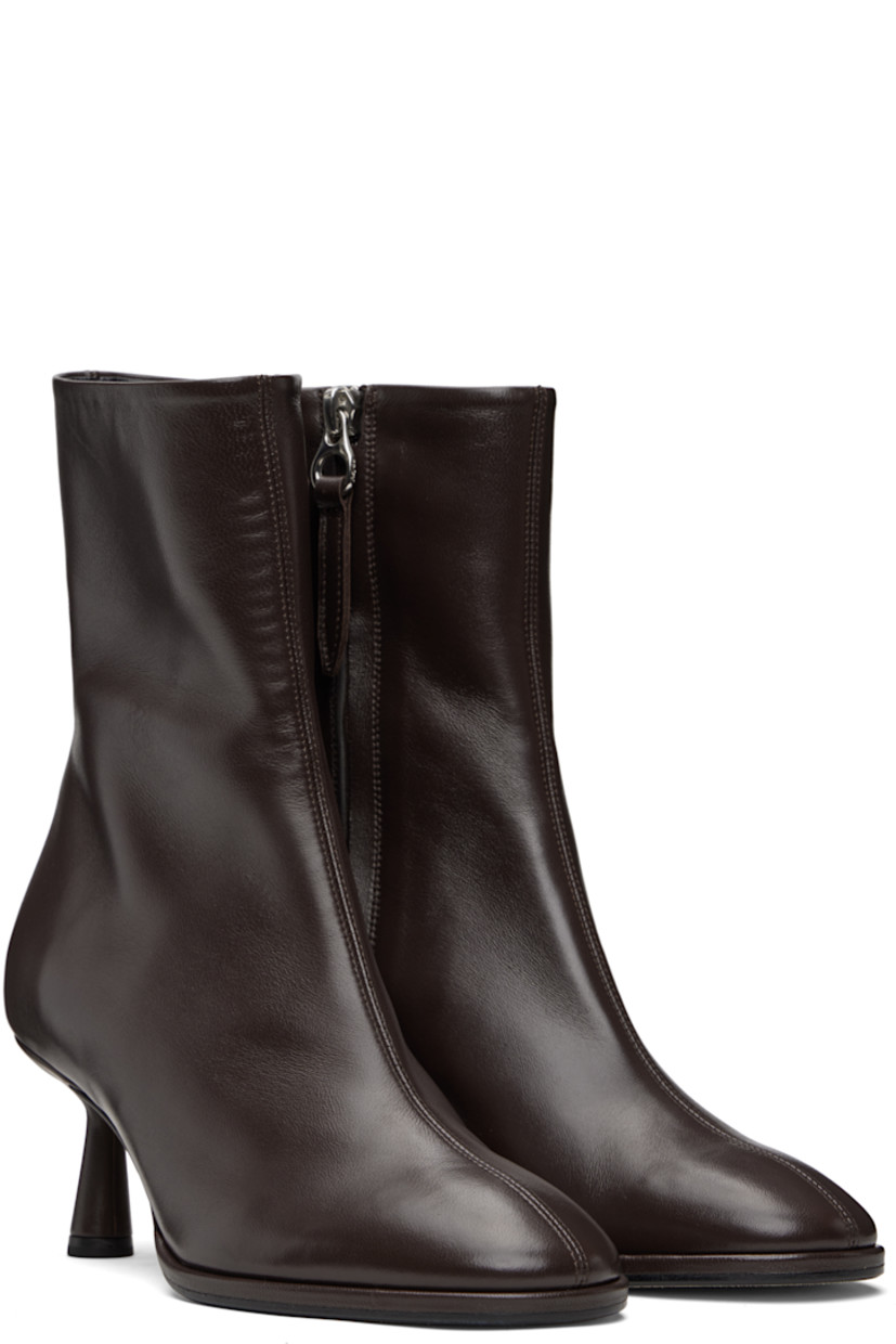 Ankle-high buffed nappa leather boots.

· Zip closure at inner side
· Lambskin lining 
· Red stitch at heel counter
· Covered spool heel 
· Nubuck sole with rubber injections
· Heel: H2.5"

Supplier color: Moka nappa