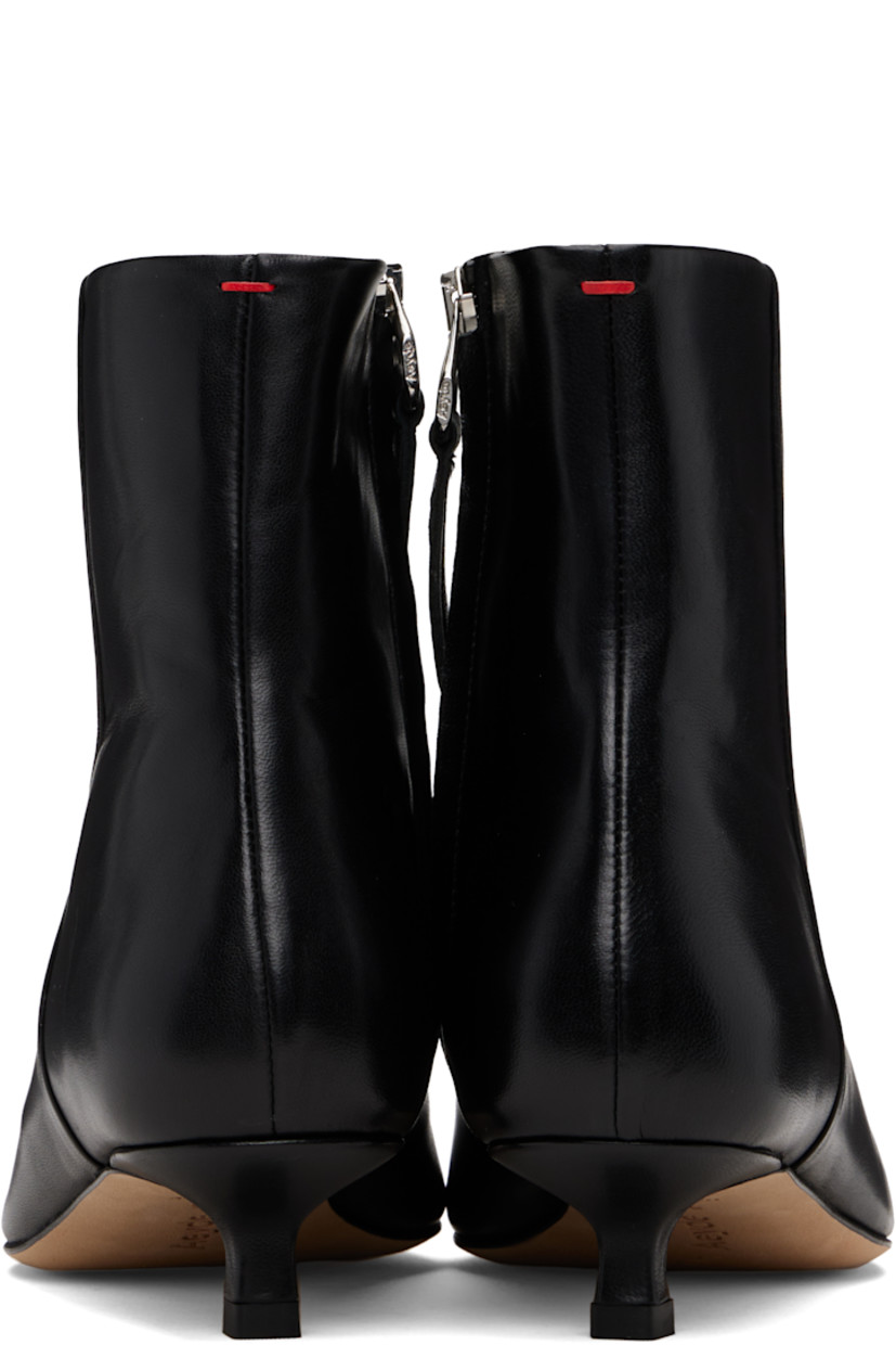 Ankle-high buffed nappa leather boots.

· Pointed toe
· Zip closure at inner side
· Red stitch at heel collar
· Buffed lambskin lining
· Covered kitten heel
· Leather sole with rubber injections
· Heel: H1"

Supplier color: Black nappa