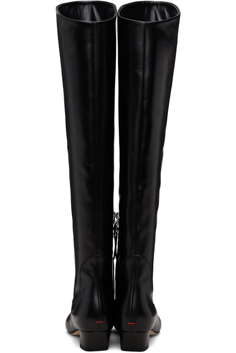 Knee-high buffed calfskin boots.

· Almond toe
· Zip closure at inner side
· Red stitch at heel counter
· Buffed leather lining
· Block heel with rubber injection
· Leather sole
· Heel: H1.5"

Supplier color: Black