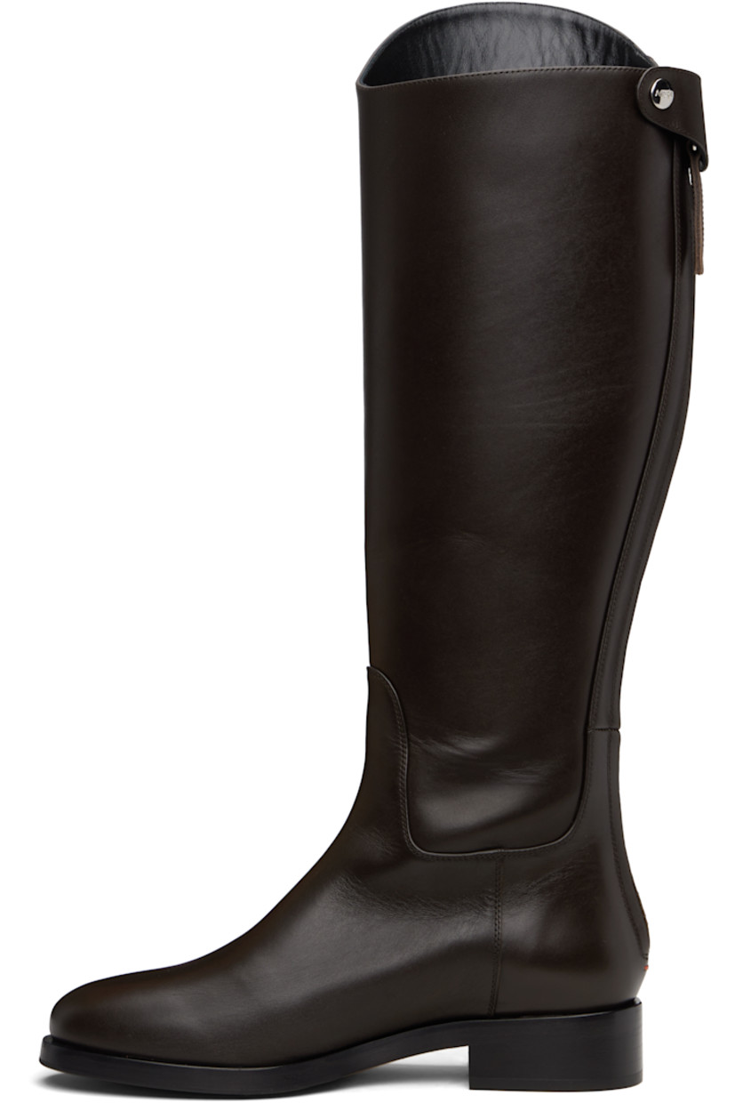 Knee-high buffed calfskin boots.

· Press-stud tab and zip closure at heel
· Red stitch at heel counter
· Buffed leather lining
· Stacked leather midsole and block heel
· Smooth rubber sole
· Logo-engraved silver-tone hardware
· Heel: H1.25"

Supplier color: Moka