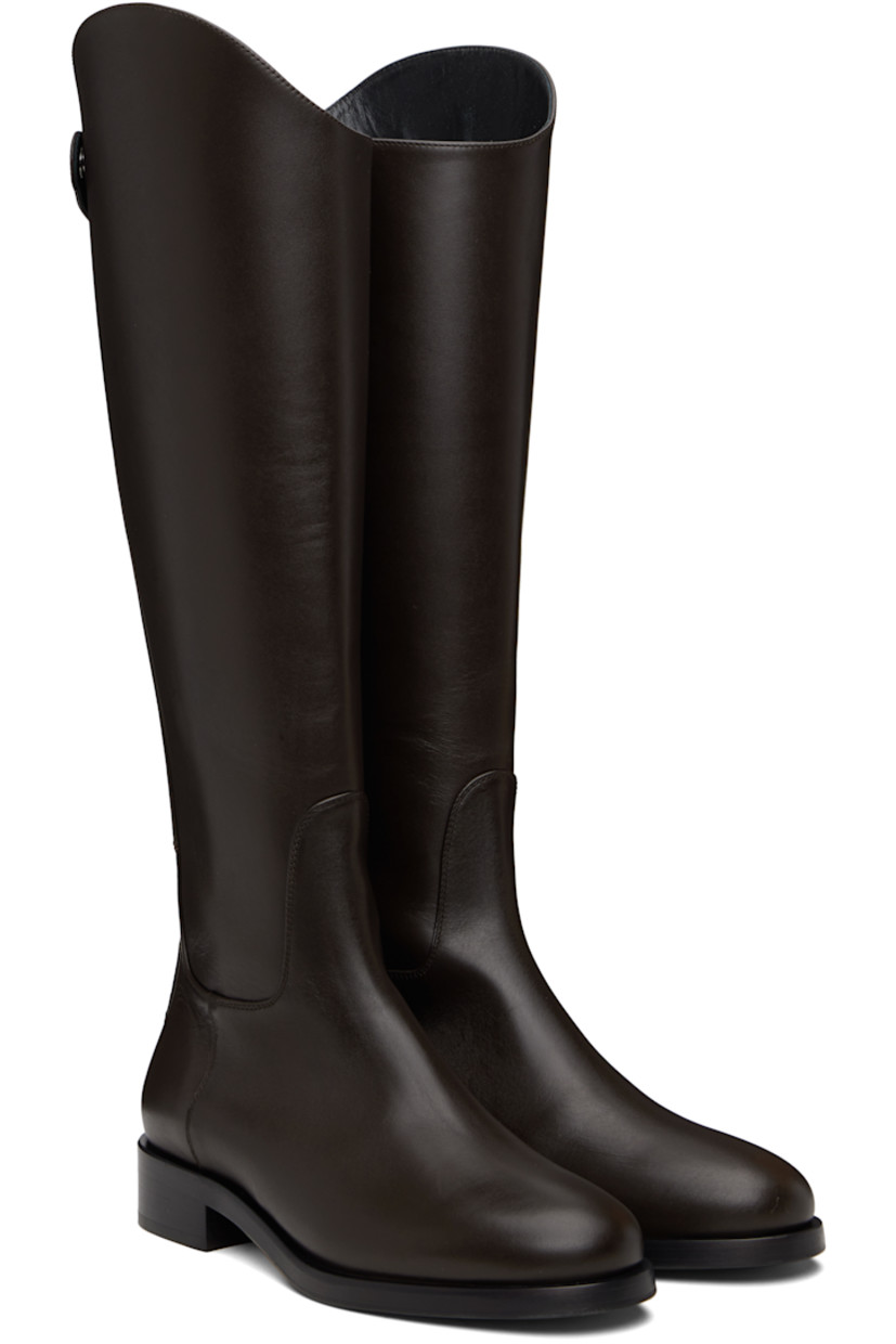 Knee-high buffed calfskin boots.

· Press-stud tab and zip closure at heel
· Red stitch at heel counter
· Buffed leather lining
· Stacked leather midsole and block heel
· Smooth rubber sole
· Logo-engraved silver-tone hardware
· Heel: H1.25"

Supplier color: Moka