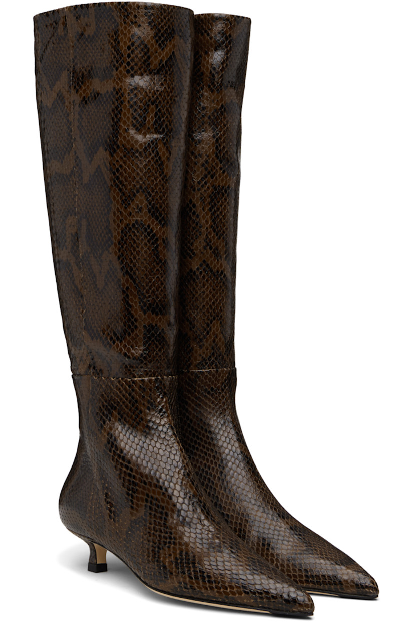Knee-high snake-embossed calfskin boots.

· Paneled construction
· Pointed toe
· Zip closure at inner side
· Red stitch at heel
· Buffed leather lining
· Kitten heel
· Leather sole with rubber injections
· Heel: H1.25"

Supplier color: Moka