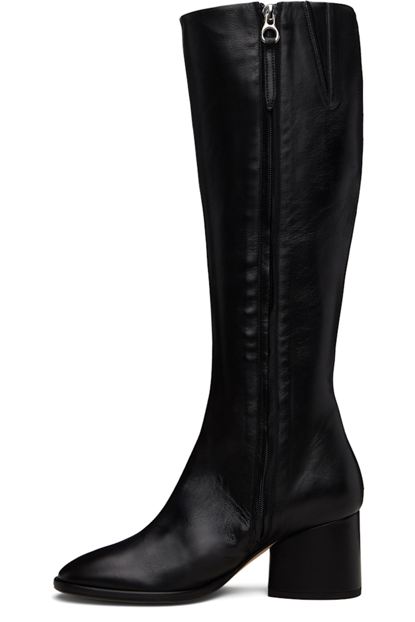 Knee-high grained nappa leather boots.

· Central seam at vamp
· Concealed elasticized gusset at collar
· Zip closure at inner side
· Red stitch at heel
· Buffed leather lining
· Block heel with rubber injection
· Leather sole
· Heel: H2.5"

Supplier color: Black