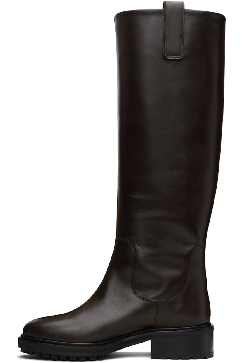 Knee-high buffed calfskin boots.

· Pull-loops at collar
· Red stitch at heel counter
· Buffed lambskin lining
· Stacked leather and rubber midsole and block heel
· Treaded rubber sole
· Heel: H1.5"

Supplier color: Moka