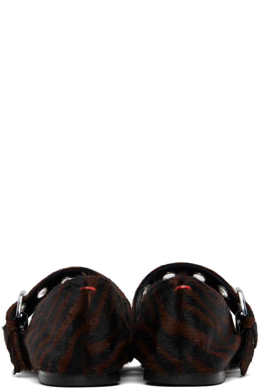 Calf-hair Mary Jane-style ballerina flats in black and brown.

· Graphic pattern printed throughout
· Square toe
· Pin-buckle strap with eyelets at vamp
· Red stitch at heel collar
· Buffed lambskin lining
· Rubber heel
· Leather sole

Supplier color: Moka ponyhair