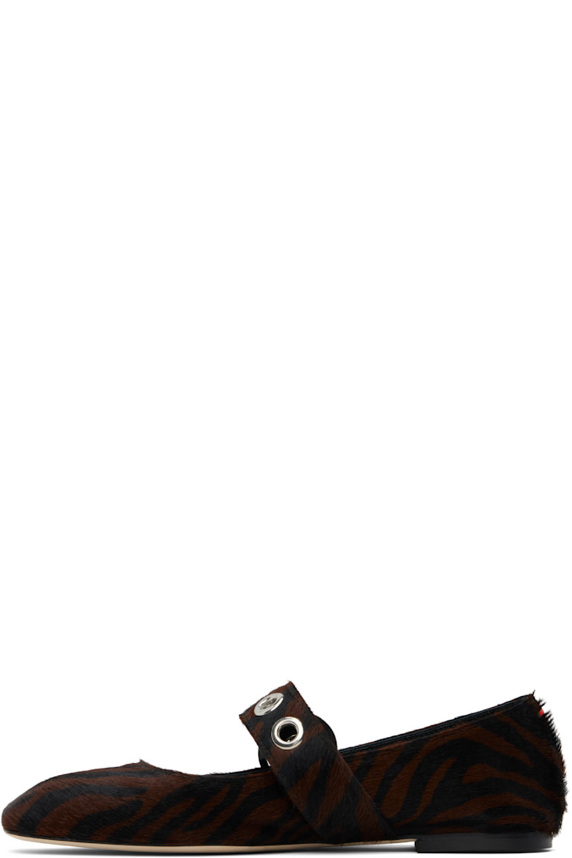 Calf-hair Mary Jane-style ballerina flats in black and brown.

· Graphic pattern printed throughout
· Square toe
· Pin-buckle strap with eyelets at vamp
· Red stitch at heel collar
· Buffed lambskin lining
· Rubber heel
· Leather sole

Supplier color: Moka ponyhair