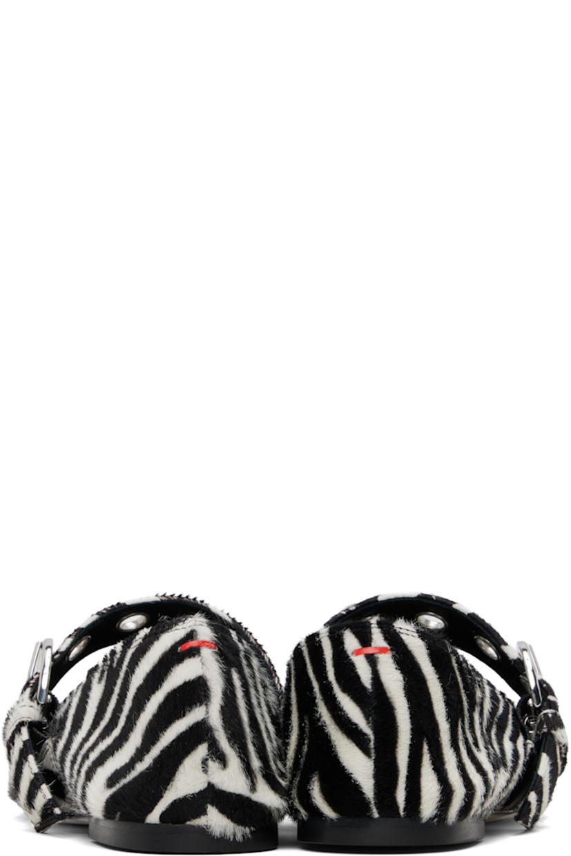 Calf-hair Mary Jane-style ballerina flats in black and white.

· Graphic pattern printed throughout
· Square toe
· Pin-buckle strap with eyelets at vamp
· Red stitch at heel collar
· Buffed lambskin lining
· Rubber heel
· Leather sole

Supplier color: Creamy ponyhair