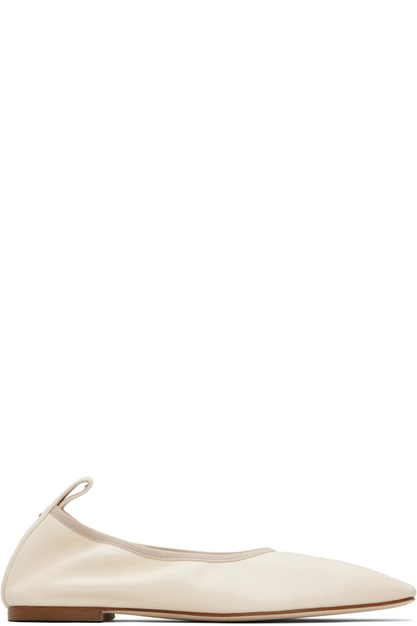Buffed nappa leather ballerina flats. 

· Square toe 
· Elasticized collar 
· Pull-loop and red stitch at heel tab 
· Rubber heel
· Nubuck sole 

Supplier color: Creamy nappa