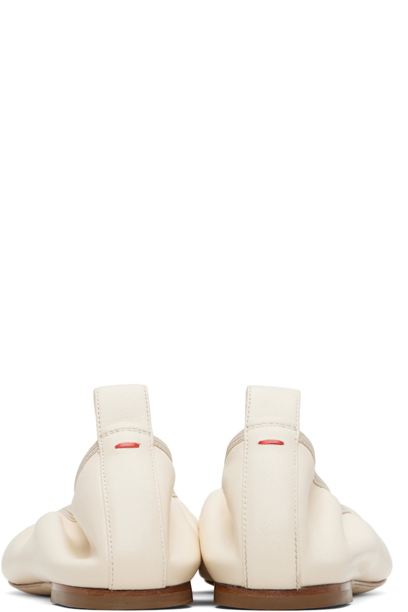 Buffed nappa leather ballerina flats. 

· Square toe 
· Elasticized collar 
· Pull-loop and red stitch at heel tab 
· Rubber heel
· Nubuck sole 

Supplier color: Creamy nappa