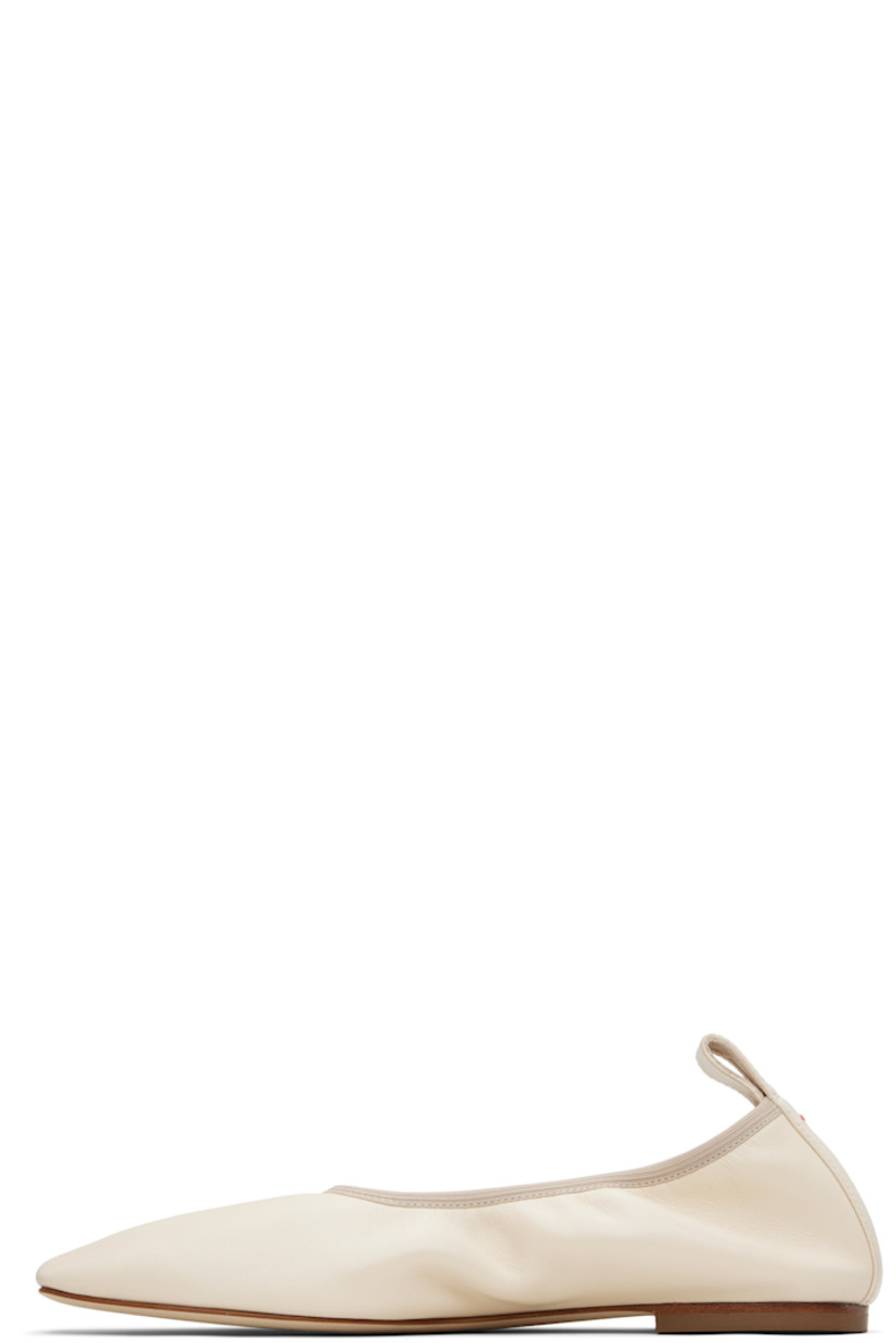 Buffed nappa leather ballerina flats. 

· Square toe 
· Elasticized collar 
· Pull-loop and red stitch at heel tab 
· Rubber heel
· Nubuck sole 

Supplier color: Creamy nappa