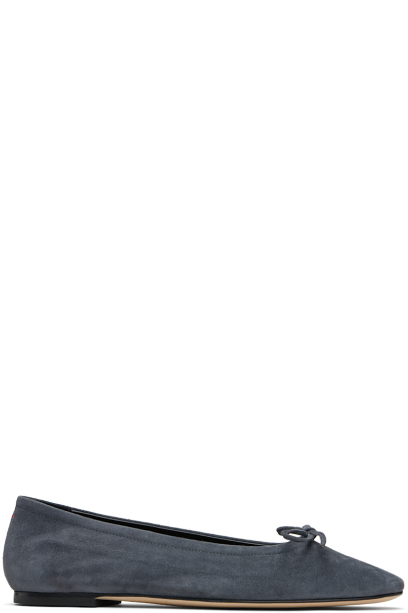 Kidskin suede ballerina flats.

· Square toe 
· Bow accent at vamp
· Red stitch at heel tab
· Lambskin lining 
· Nubuck sole with rubber injection 

Supplier color: Charcoal suede