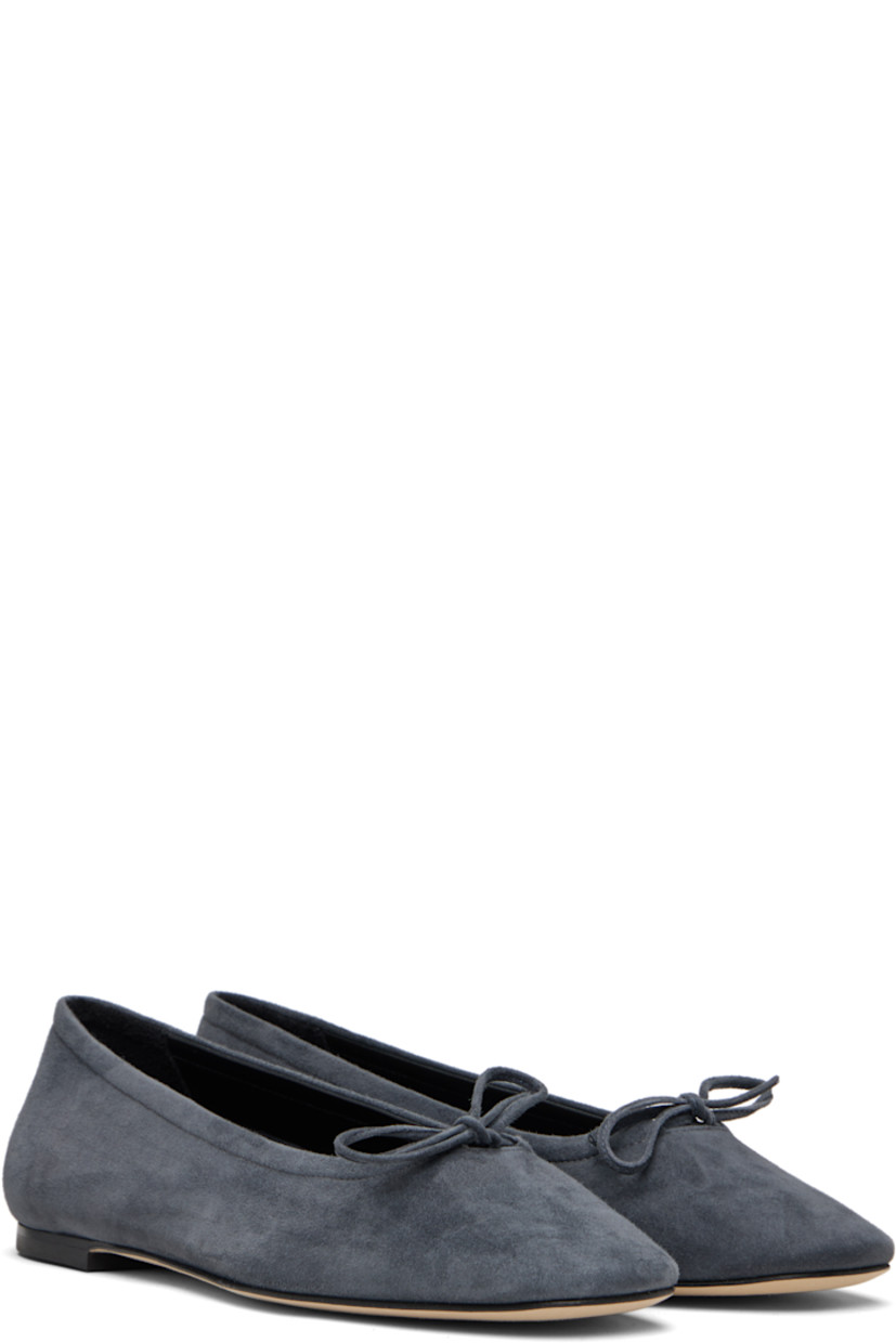 Kidskin suede ballerina flats.

· Square toe 
· Bow accent at vamp
· Red stitch at heel tab
· Lambskin lining 
· Nubuck sole with rubber injection 

Supplier color: Charcoal suede