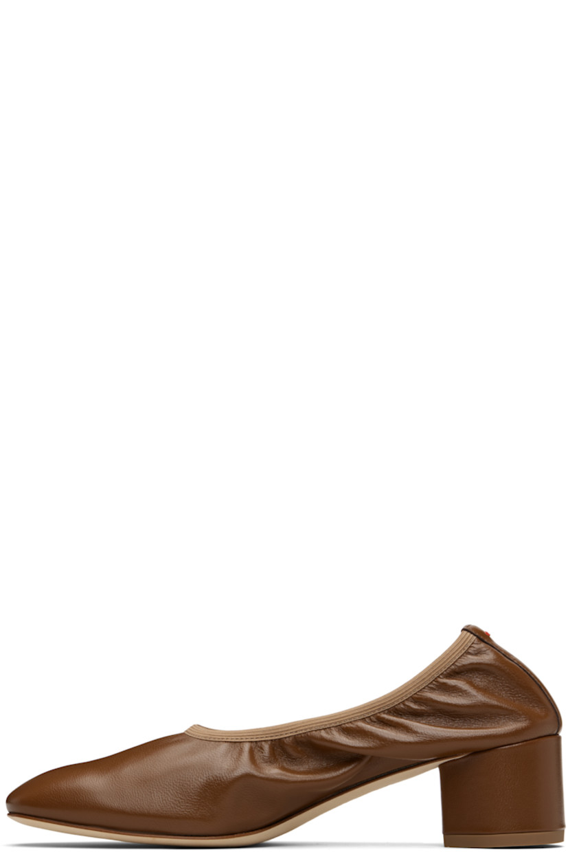 Grained nappa leather ballerina-style heels.

· Elasticized collar
· Red stitch at heel tab
· Suede interior
· Covered block heel with rubber injection
· Nubuck sole
· Heel: H2"

Supplier color: Tobacco