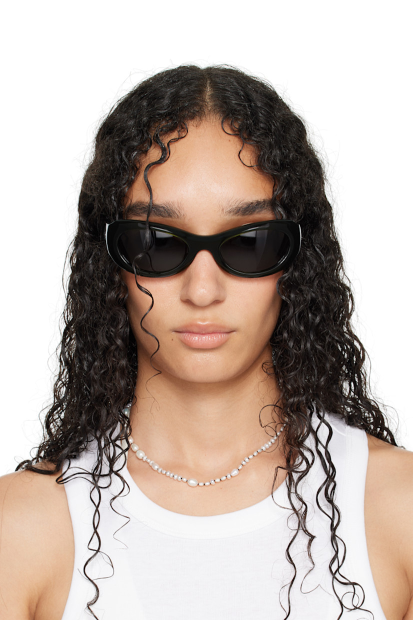 Handcrafted oval cat-eye semi-transparent acetate-frame sunglasses in green. 

· Green lenses
· 100% UVA/UVB protection 
· Integrated nose pads
· Rivets at temples
· Exposed core wires 
· Includes pouch
· Size: 53.21 135

Part of the exclusive SSENSE HEAT capsule.

Supplier color: Green/Green