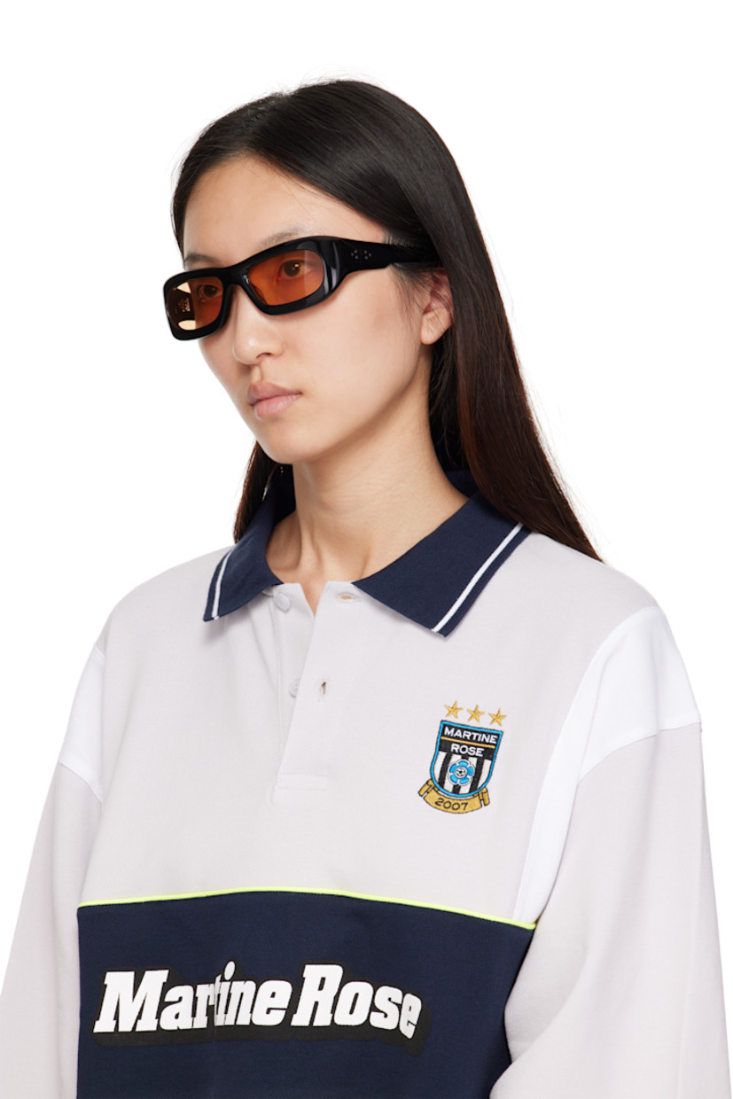 Handcrafted rectangular cellulose acetate-frame sunglasses.

· Brown lenses
· 100% UVA/UVB protection
· Integrated nose pads
· Signature rivets at temples
· Includes pouch
· Size: 56.19 137

Part of the Bast collection.

Supplier color: Black/Amber