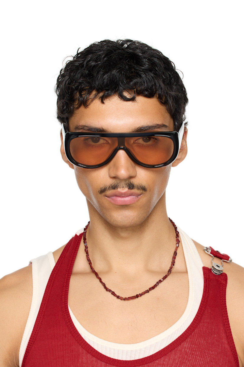 Handcrafted aviator-style acetate-frame sunglasses in black. 

· Orange lens
· 100% UVA/UVB protection 
· Integrated nose pads
· Rivets at temples
· Includes pouch
· Size: 52.22 135

Part of the exclusive SSENSE HEAT capsule.

Supplier color: Black/Yellow
