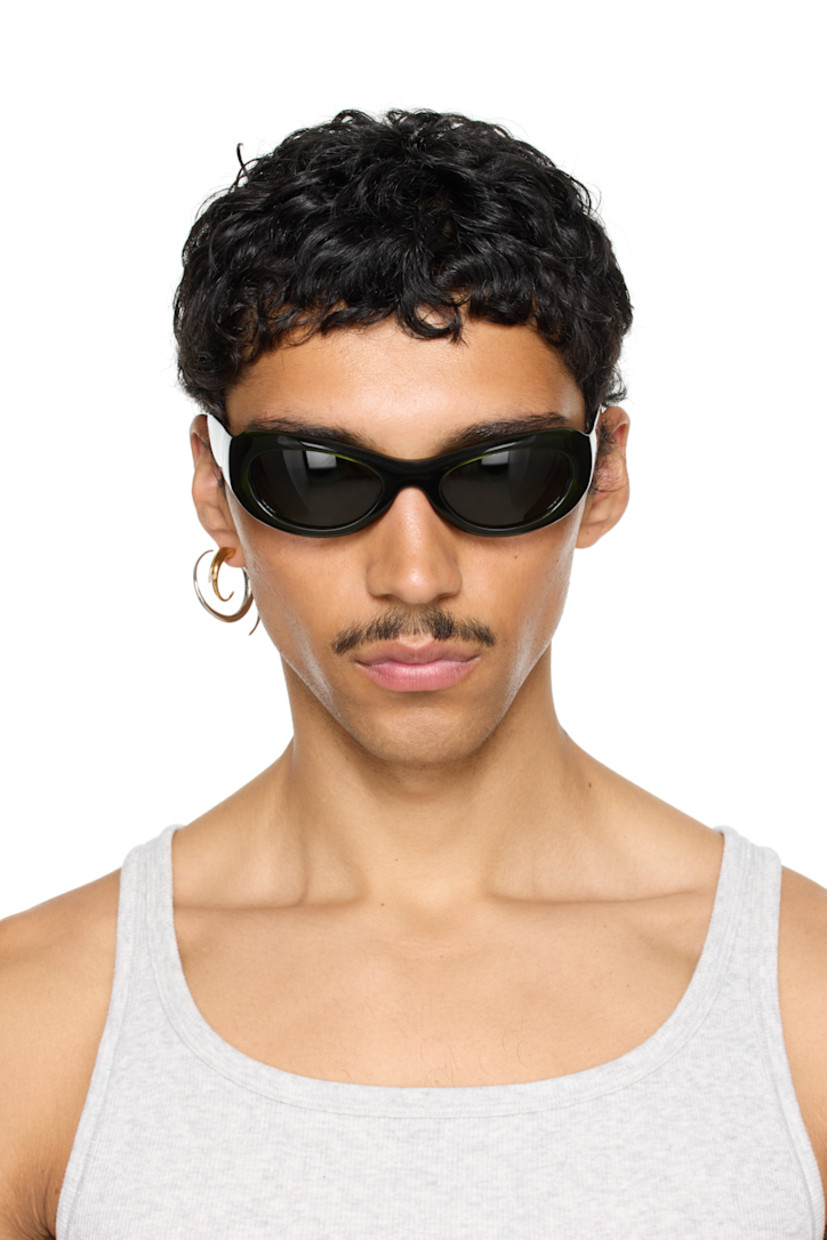 Handcrafted oval cat-eye semi-transparent acetate-frame sunglasses in green. 

· Green lenses
· 100% UVA/UVB protection 
· Integrated nose pads
· Rivets at temples
· Exposed core wires 
· Includes pouch
· Size: 53.21 135

Part of the exclusive SSENSE HEAT capsule.

Supplier color: Green/Green
