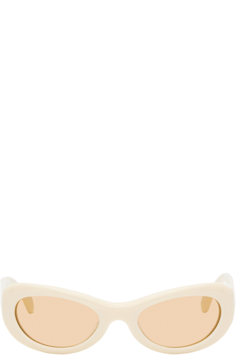 Handcrafted oval cat-eye semi-transparent acetate-frame sunglasses in beige. 

· Orange lenses
· 100% UVA/UVB protection 
· Integrated nose pads
· Rivets at temples
· Semi-exposed core wires 
· Includes pouch
· Size: 53.21 135

Part of the exclusive SSENSE HEAT capsule.

Supplier color: Ivory/Amber