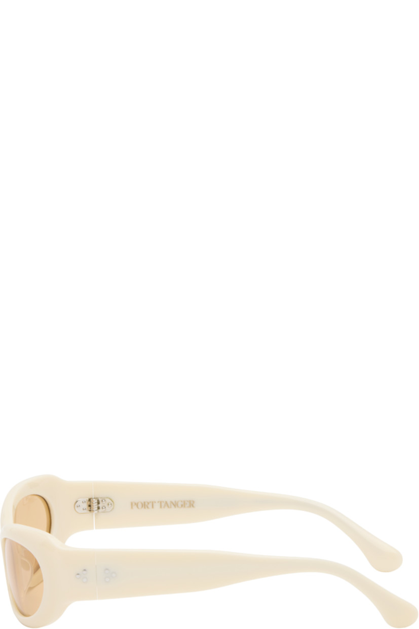 Handcrafted oval cat-eye semi-transparent acetate-frame sunglasses in beige. 

· Orange lenses
· 100% UVA/UVB protection 
· Integrated nose pads
· Rivets at temples
· Semi-exposed core wires 
· Includes pouch
· Size: 53.21 135

Part of the exclusive SSENSE HEAT capsule.

Supplier color: Ivory/Amber