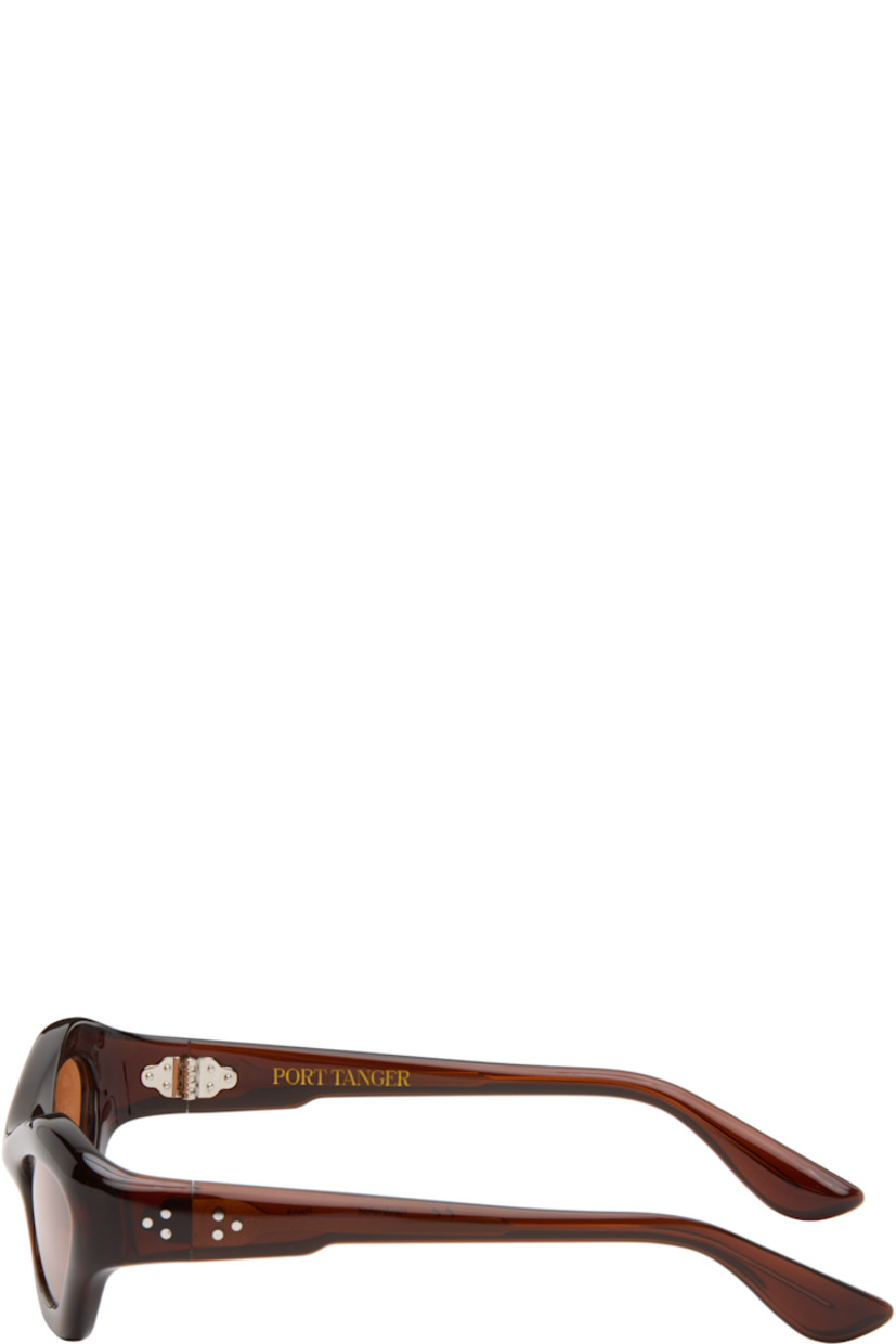 Handcrafted cat-eye cellulose acetate-frame sunglasses.

· Brown lenses
· 100% UVA/UVB protection
· Integrated nose pads
· Signature rivets at temples
· Includes pouch
· Size: 57.20 137

Part of the Bast collection.

Supplier color: Bunaa/Amber