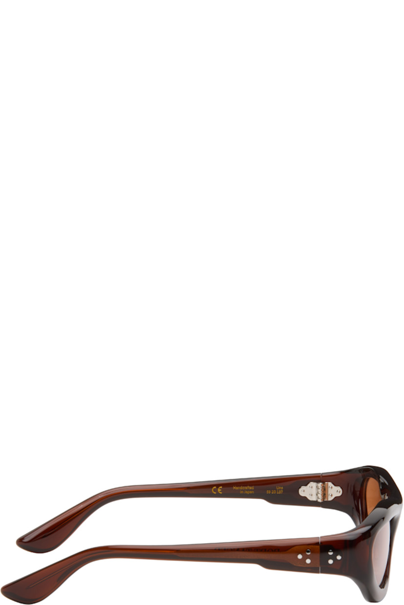 Handcrafted oval cellulose acetate-frame sunglasses.

· Brown lenses
· 100% UVA/UVB protection
· Integrated nose pads
· Signature rivets at temples
· Exposed core wires
· Includes pouch
· Size: 59.20 137

Part of the Bast collection.

Supplier color: Bunaa/Amber
